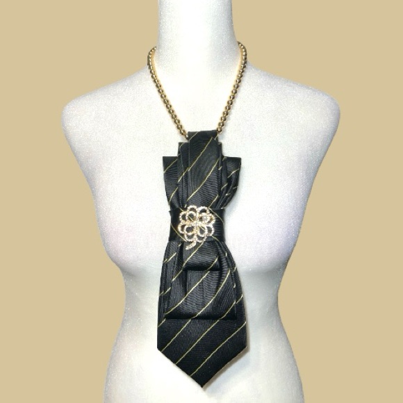 Elegant Black And Gold Necklace With Floral Accent